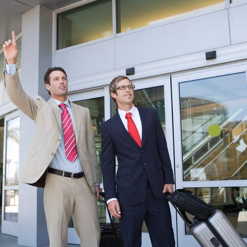 businessman-hailing-taxi-at-airport-2026-01-11-09-58-37-utc